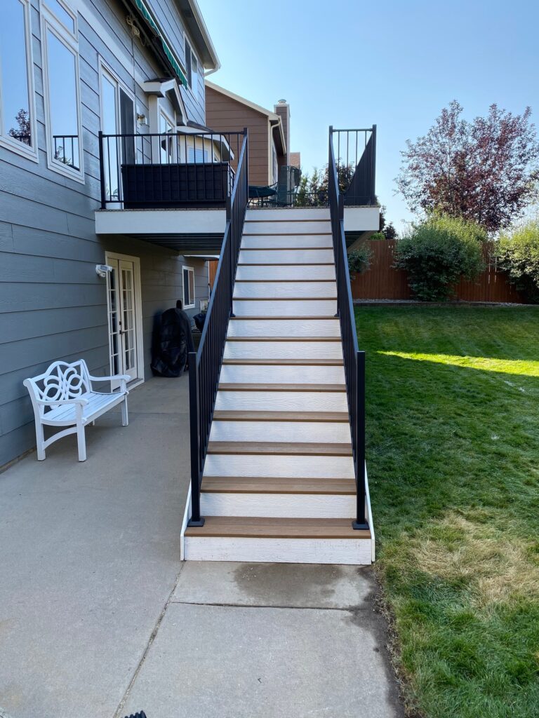 Outdoor staircase leading to upper deck.